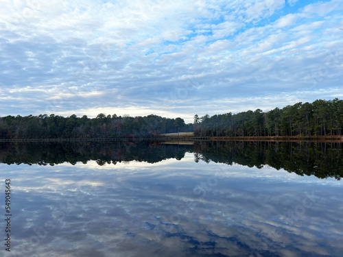 Reflections on the lake at sunset at Cheraw State Park, Cheraw, South Carolina, a popular camping and golf destination.