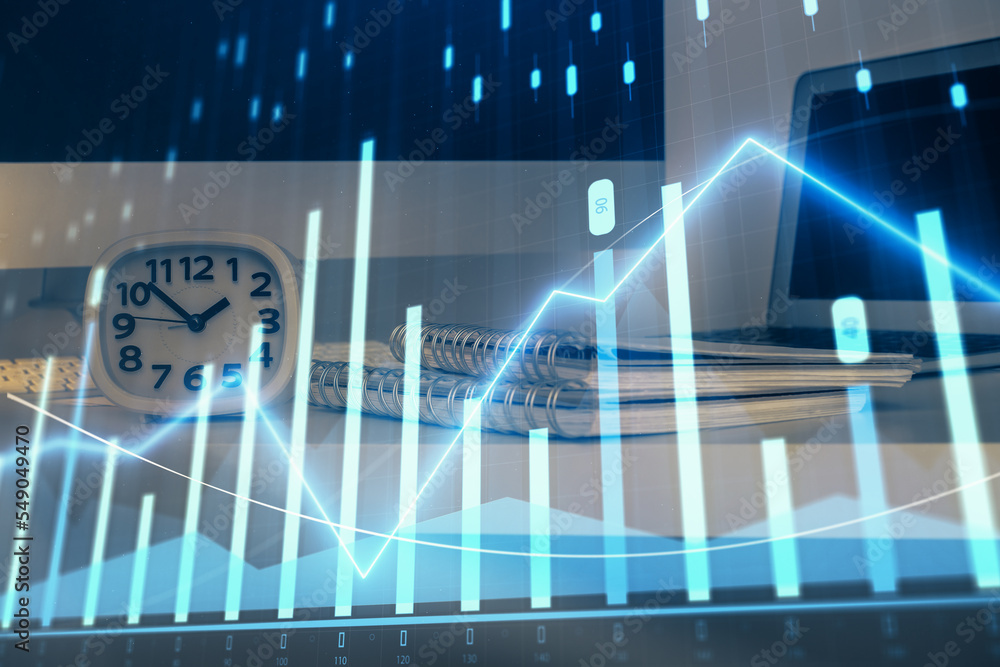 Obraz premium Forex graph hologram on table with computer background. Multi exposure. Concept of financial markets.
