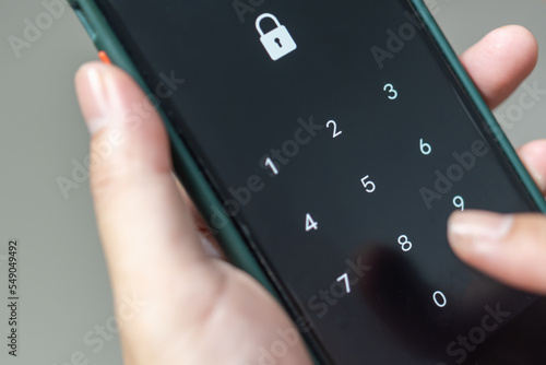 Hacking mobile phone with a password to access a smartphone, security threats online Phone lock code. Smartphone protection with 2fa Smartphone protection and security with pin number. Encrypted data.