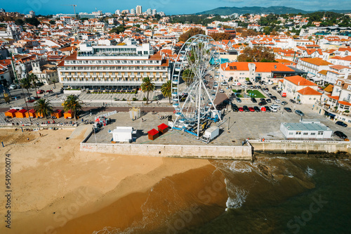 Aerial view of Cascais bay, Portugal with giant ferris wheel visible which was set up for the Christmas season