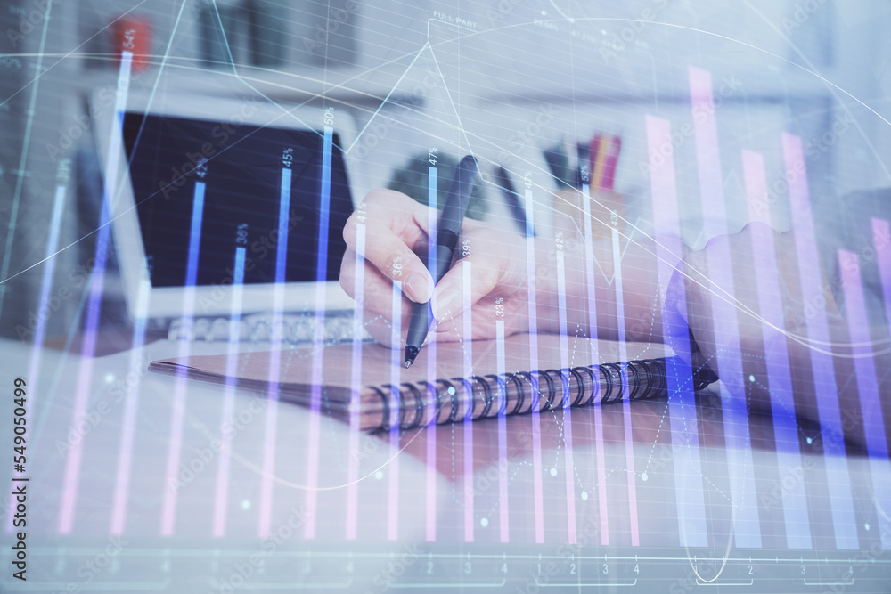 Financial graph displayed on woman's hand taking notes background. Concept of research. Double exposure Financial graph displayed on woman's hand taking notes background. Concept of research. Double exposure
