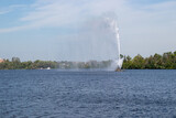 water fountain in the middle of a lake  - Centennial Fountain in Little Lake