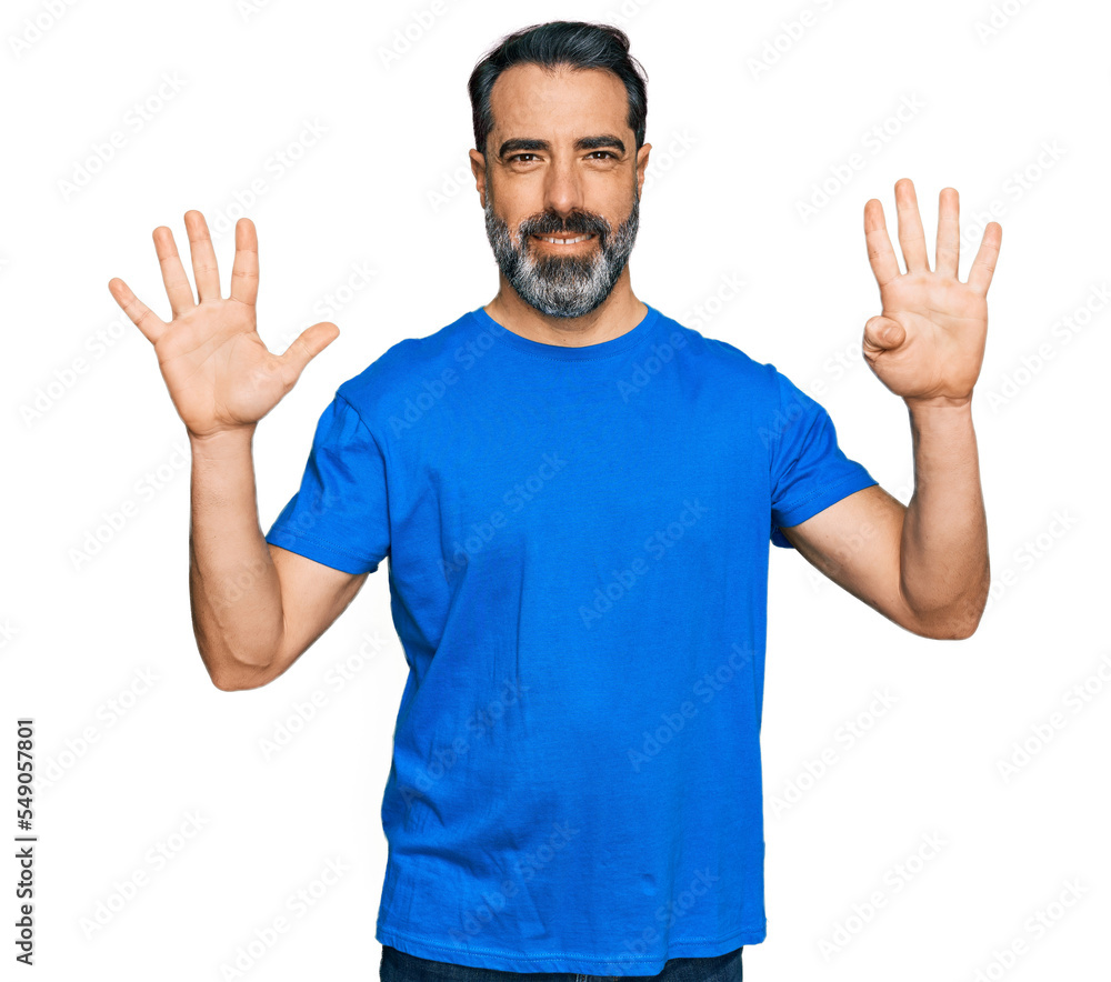 Middle aged man with beard wearing casual blue t shirt showing and pointing up with fingers number nine while smiling confident and happy. Middle aged man with beard wearing casual blue t shirt showing and pointing up with fingers number nine while smiling confident and happy.