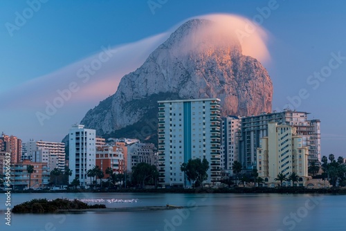 Low-angle view of modern buildings near the lake in Calp, Spain photo