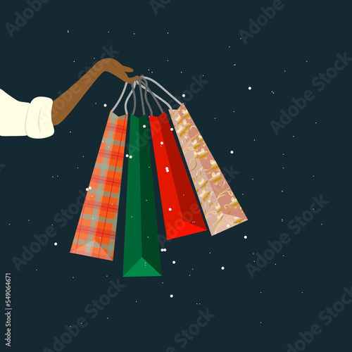 Woman’s hand holding colourful shopping bags. Cartoon winter vector illustration.