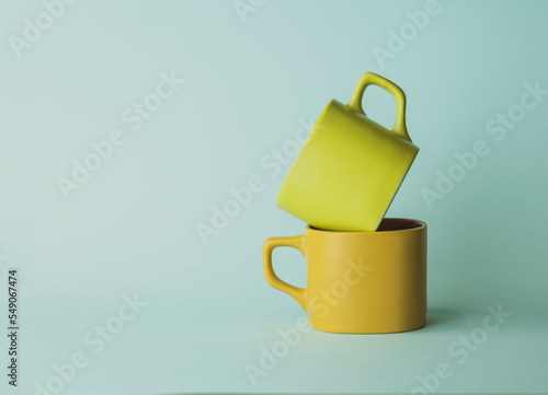 for tea and coffee. yellow cups for drinks. colored utensils.