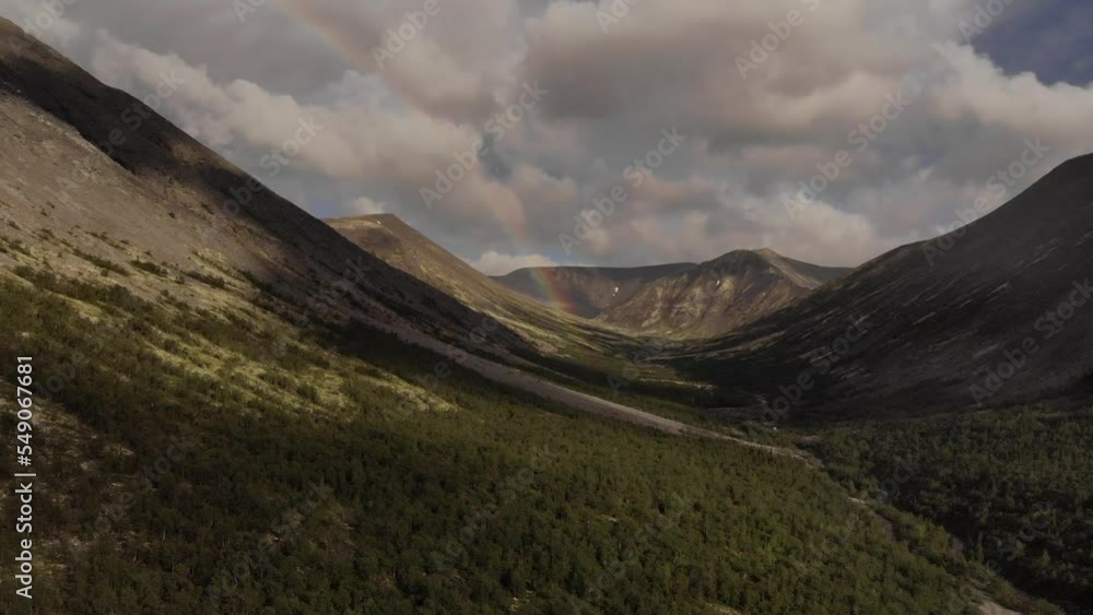 Beautiful rainbow in the mountains Beautiful rainbow in the mountains