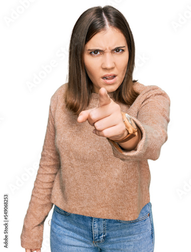 Young beautiful woman wearing casual clothes pointing displeased and frustrated to the camera, angry and furious with you