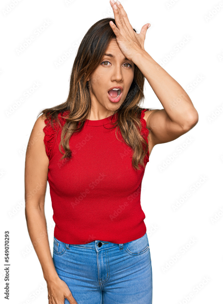 Young hispanic woman wearing casual clothes surprised with hand on head for mistake, remember error. forgot, bad memory concept. Young hispanic woman wearing casual clothes surprised with hand on head for mistake, remember error. forgot, bad memory concept.