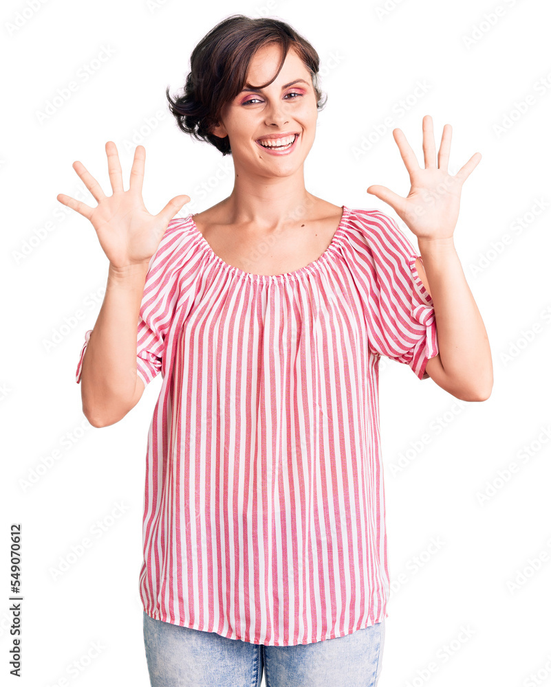 Beautiful young woman with short hair wearing casual summer clothes showing and pointing up with fingers number ten while smiling confident and happy. Beautiful young woman with short hair wearing casual summer clothes showing and pointing up with fingers number ten while smiling confident and happy.