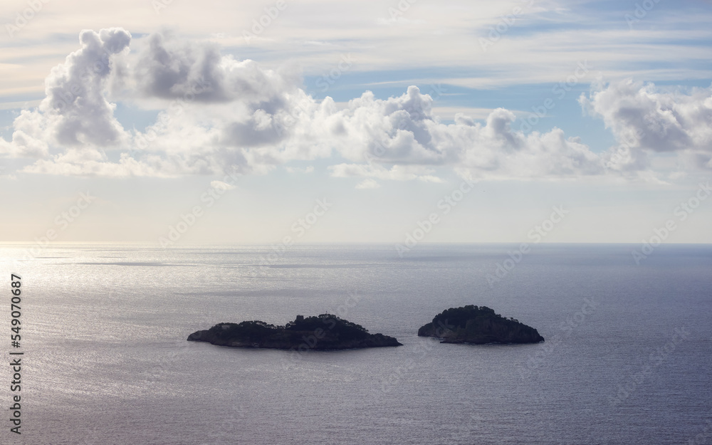 Rocky Islands on Tyrrhenian Sea near Amalfi Coast, Italy. Sunny and Cloudy Day. Rocky Islands on Tyrrhenian Sea near Amalfi Coast, Italy. Sunny and Cloudy Day.