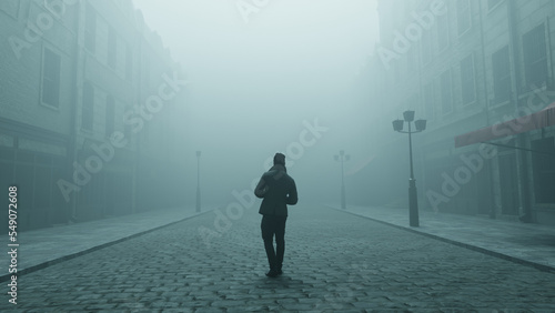 silhouette of a man walking in the fog on lonely moody cobblestone street