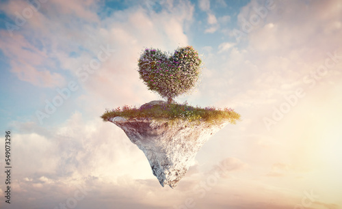 Heart shape tree on floating island in clouds photo
