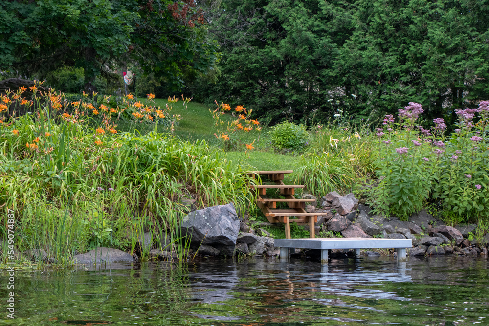 Naklejka premium garden steps leading to a river