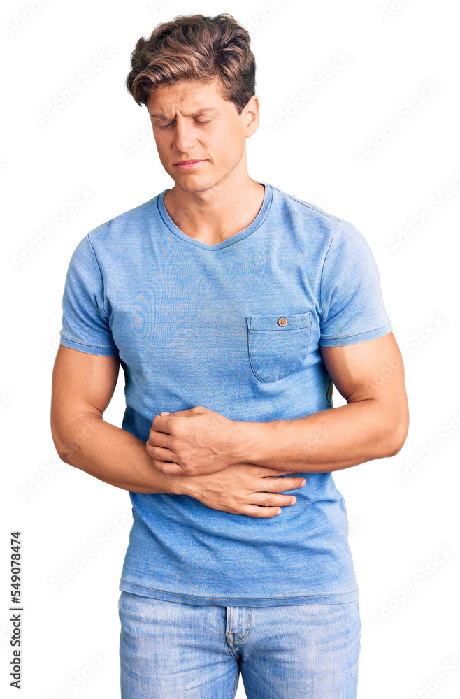 Young handsome man wearing casual clothes with hand on stomach because indigestion, painful illness feeling unwell. ache concept. Young handsome man wearing casual clothes with hand on stomach because indigestion, painful illness feeling unwell. ache concept.