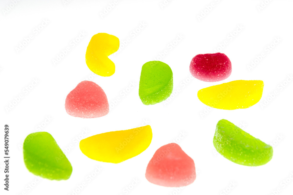 Multicolored fruit marmalade on a white background. Multicolored fruit marmalade on a white background.