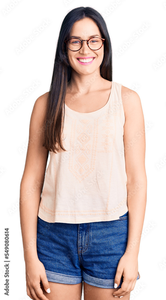 Young beautiful caucasian woman wearing casual clothes and glasses with a happy and cool smile on face. lucky person. Young beautiful caucasian woman wearing casual clothes and glasses with a happy and cool smile on face. lucky person.