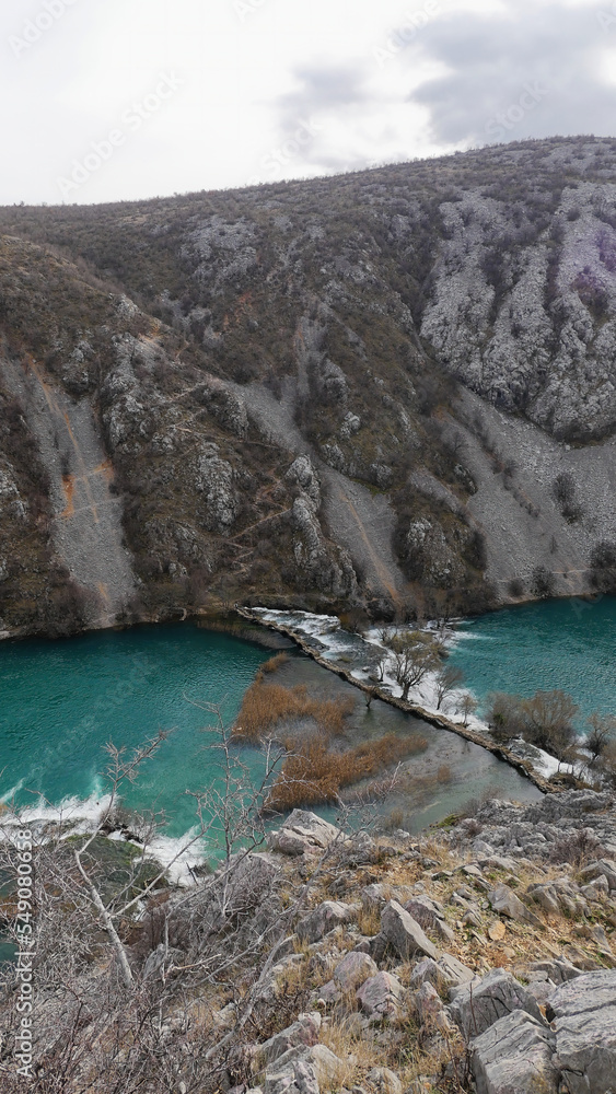 View of the beautiful canyon of the Krupa river and the old stone Kudin bridge