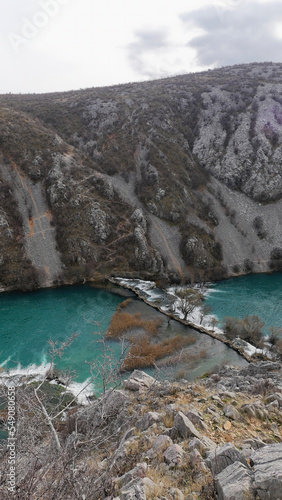 View of the beautiful canyon of the Krupa river and the old stone Kudin bridge photo