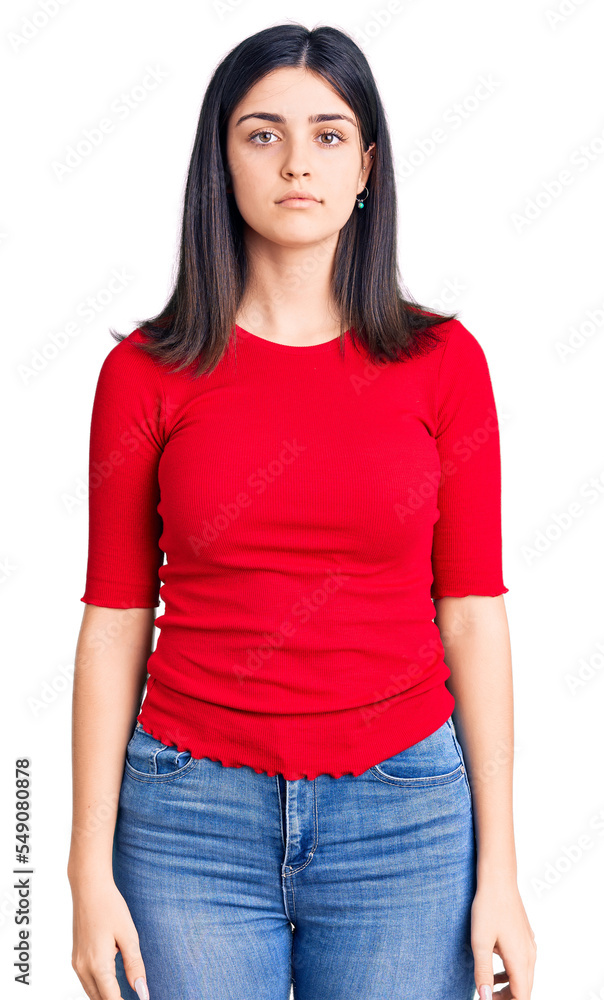 Obraz premium Young beautiful girl wearing casual t shirt with serious expression on face. simple and natural looking at the camera.