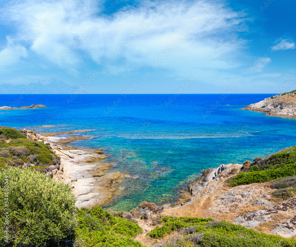 Summer stony sea coast landscape with Atthos mount view in far(Halkidiki, Sithonia, Greece). Summer stony sea coast landscape with Atthos mount view in far(Halkidiki, Sithonia, Greece).