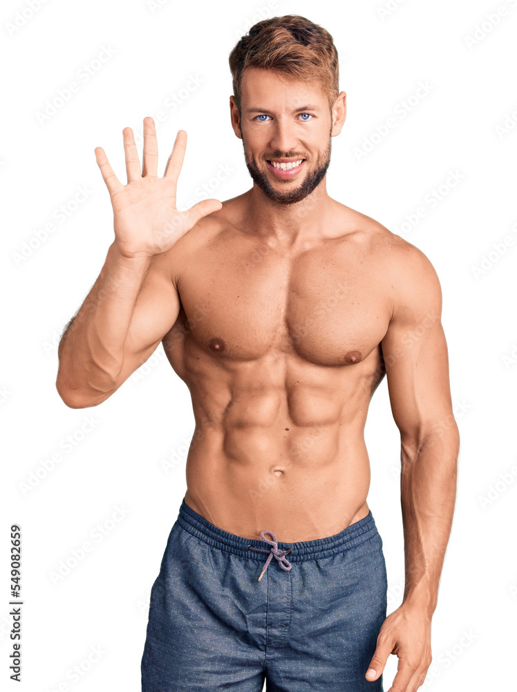 Young caucasian man standing shirtless showing and pointing up with fingers number five while smiling confident and happy. Young caucasian man standing shirtless showing and pointing up with fingers number five while smiling confident and happy.