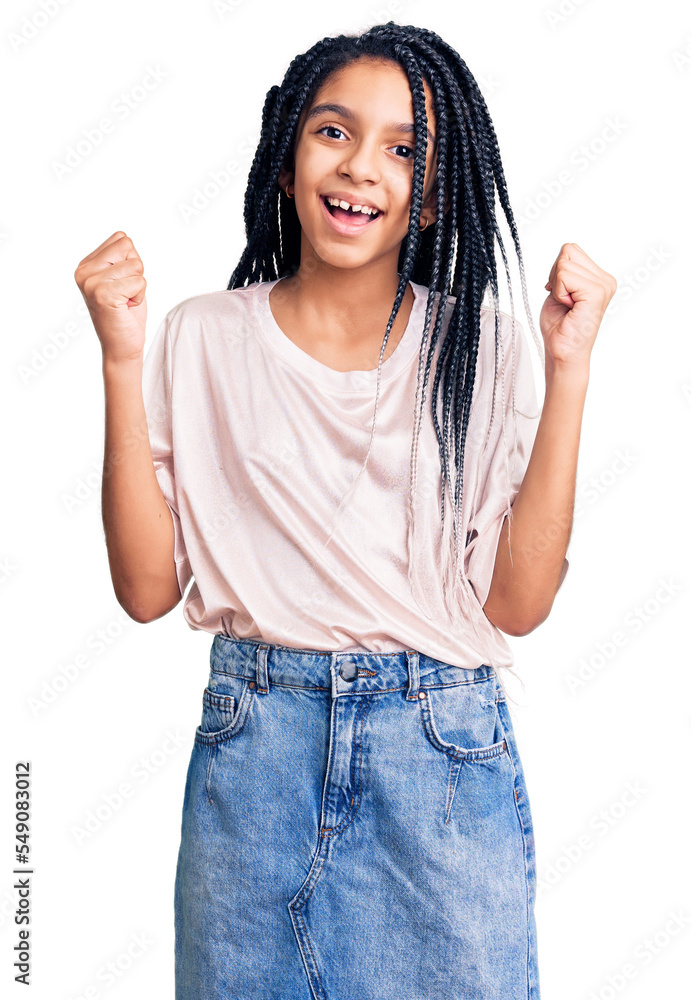 Cute african american girl wearing casual clothes screaming proud, celebrating victory and success very excited with raised arms Cute african american girl wearing casual clothes screaming proud, celebrating victory and success very excited with raised arms