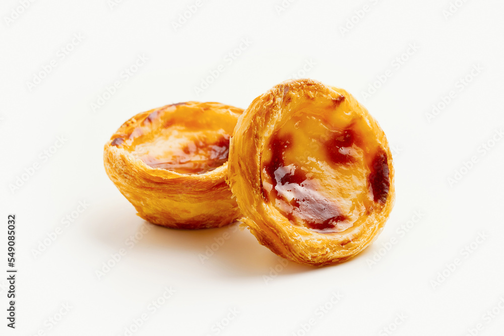 Traditional Portuguese egg tart dessert Pasteis Pastel de nata or Pasteis de Belem on white background Traditional Portuguese egg tart dessert Pasteis Pastel de nata or Pasteis de Belem on white background
