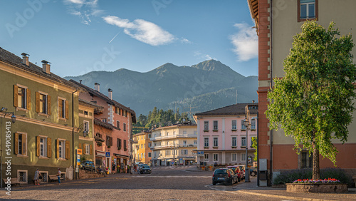 Fototapeta Naklejka Na Ścianę i Meble -  The main square at historic centre of the Cavalese, Fiemme valley, Trento district, Dolomites, Trentino Alto Adige, Italy, Europe - Juli 13, 2022