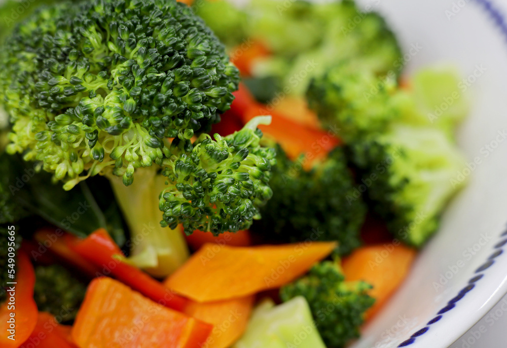 broccoli salad with carrots and paprika.Vegetables on a plate