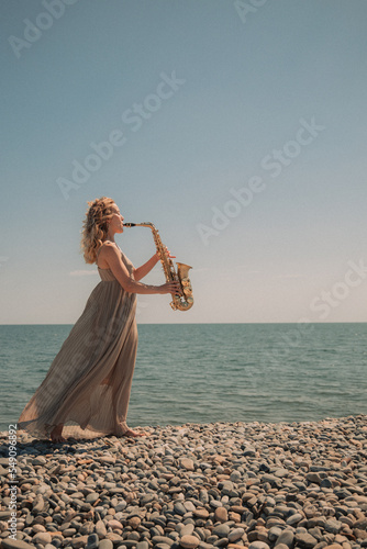 Canvas Print woman with sax on the beach