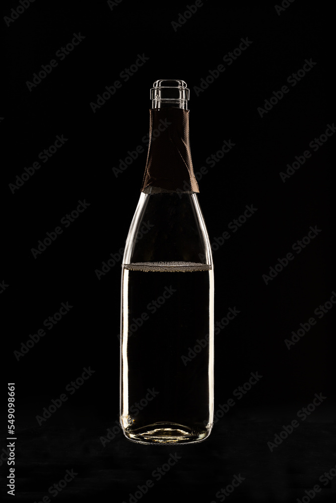 champagne bottle on black background