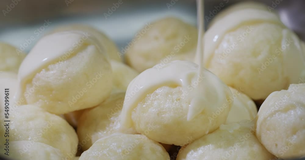 Dumplings are poured with delicious creamy sauce Dumplings are poured with delicious creamy sauce