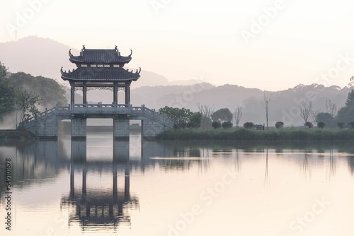 Scenic view of the West Lake, Xi lake and bridge in Hangzhou, China, on cloudy day photo