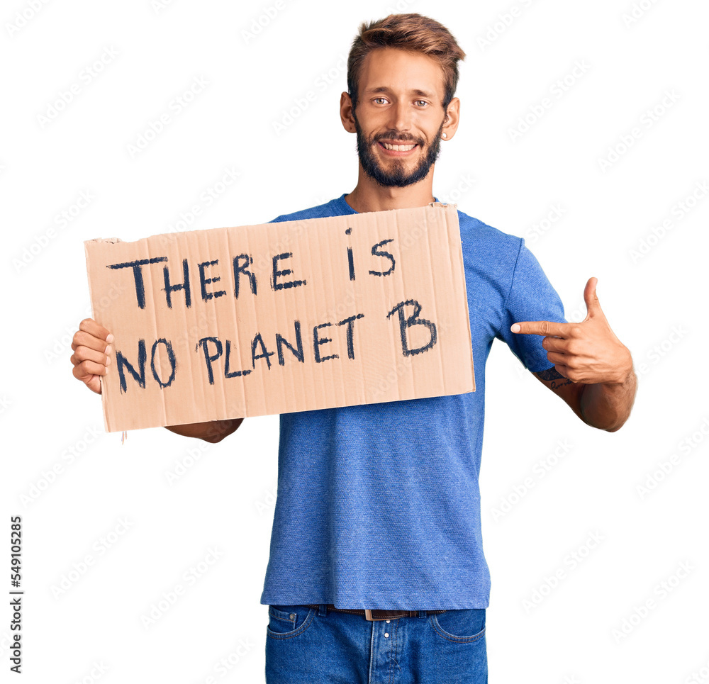 Handsome blond man with beard holding there is no planet b banner smiling happy pointing with hand and finger Handsome blond man with beard holding there is no planet b banner smiling happy pointing with hand and finger