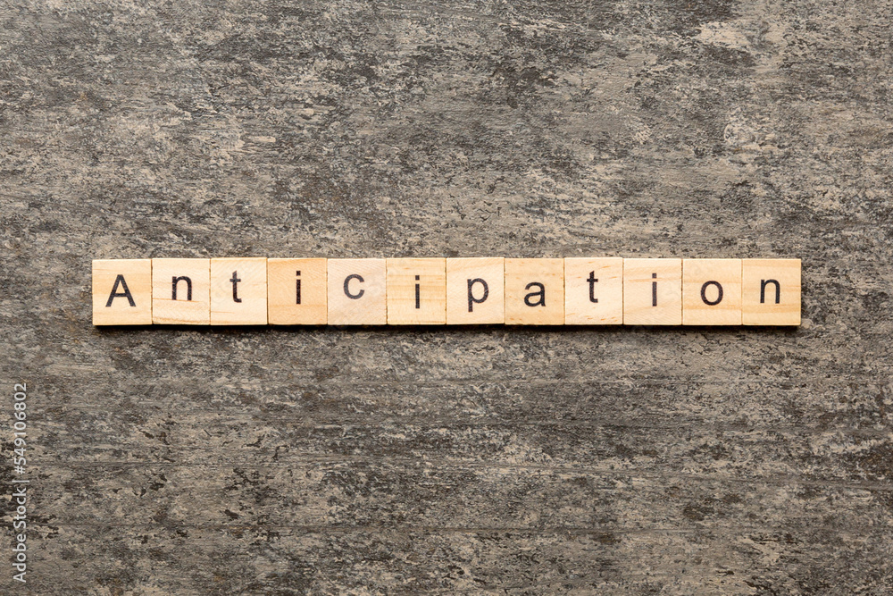 anticipation word written on wood block. anticipation text on cement table for your desing, concept anticipation word written on wood block. anticipation text on cement table for your desing, concept