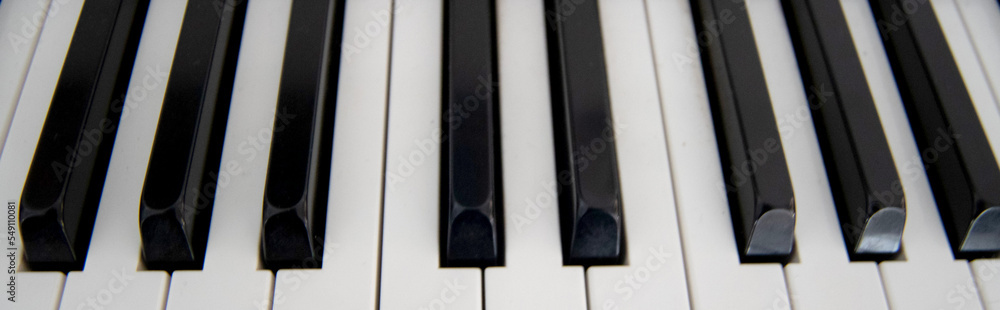 Naklejka premium piano keys close up