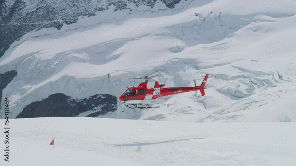 Helicopter taking off at the Jungfraujoch, Switzerland Helicopter taking off at the Jungfraujoch, Switzerland