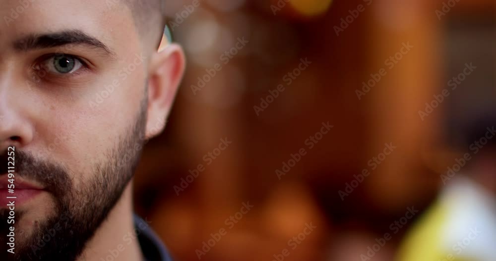 Close up of half of smiling cheerful young male face with beard. Portrait of happy handsome man at street. Outdoor. Happiness emotions and expressing joy concept. Blurred background of lights. Close up of half of smiling cheerful young male face with beard. Portrait of happy handsome man at street. Outdoor. Happiness emotions and expressing joy concept. Blurred background of lights.