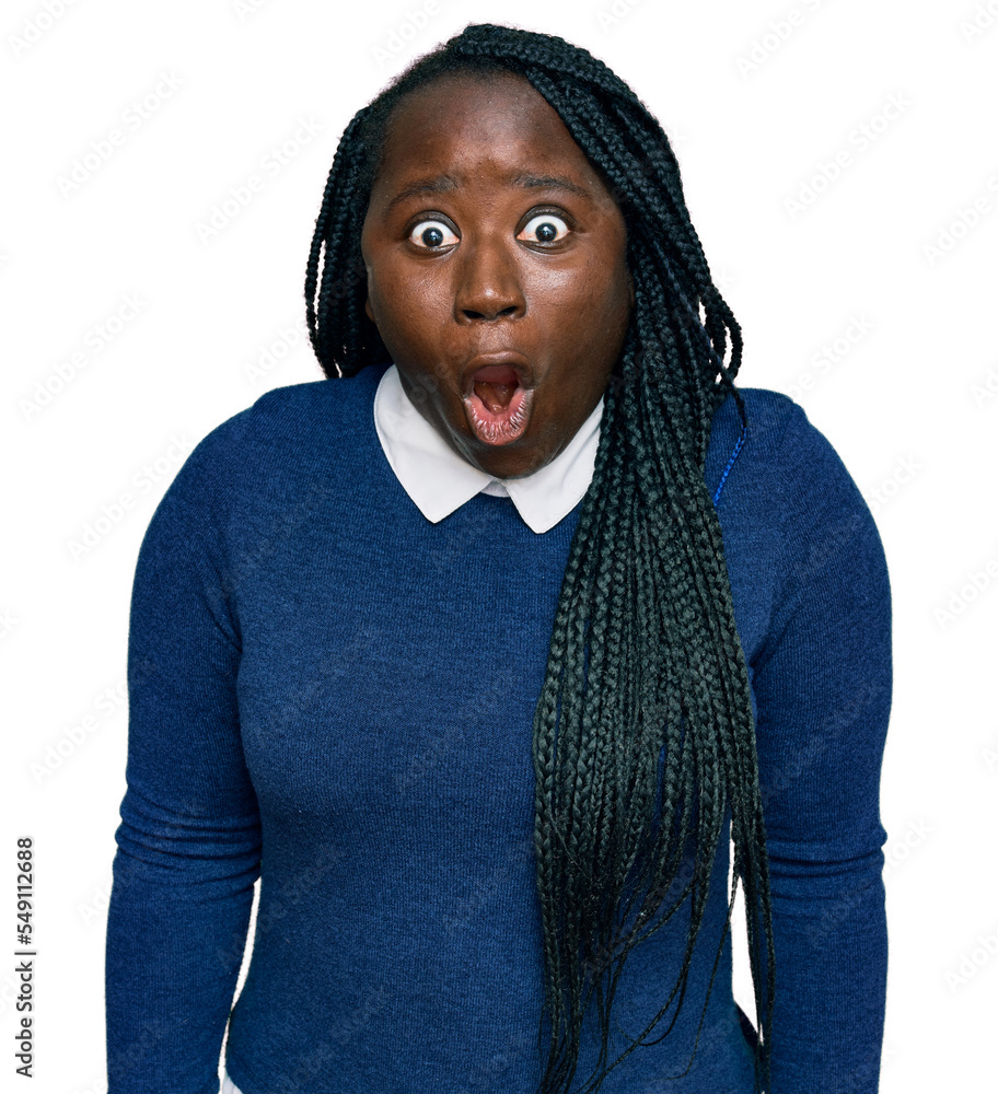Young black woman with braids wearing casual clothes afraid and shocked with surprise expression, fear and excited face. Young black woman with braids wearing casual clothes afraid and shocked with surprise expression, fear and excited face.