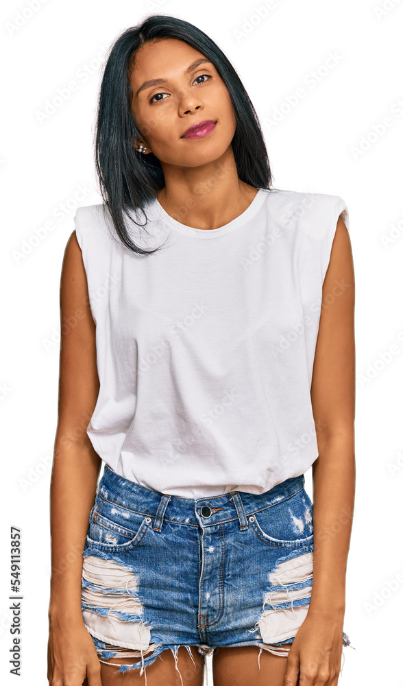 Obraz premium Young african american woman wearing casual clothes relaxed with serious expression on face. simple and natural looking at the camera.