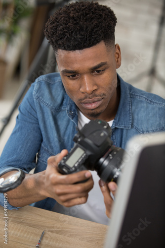 male technician assembling a dslr camera