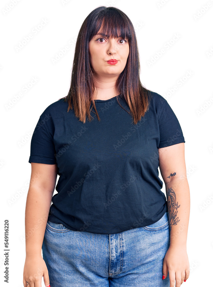 Young plus size woman wearing casual clothes depressed and worry for distress, crying angry and afraid. sad expression. Young plus size woman wearing casual clothes depressed and worry for distress, crying angry and afraid. sad expression.