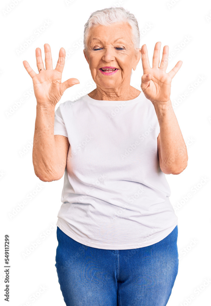 Senior beautiful woman with blue eyes and grey hair wearing casual white tshirt showing and pointing up with fingers number nine while smiling confident and happy. Senior beautiful woman with blue eyes and grey hair wearing casual white tshirt showing and pointing up with fingers number nine while smiling confident and happy.