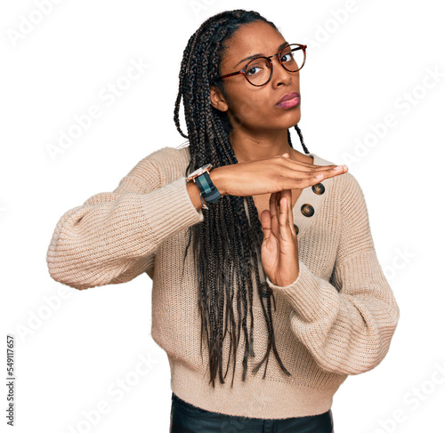 Bild auf Leinwand African american woman wearing casual clothes doing time out gesture with hands,