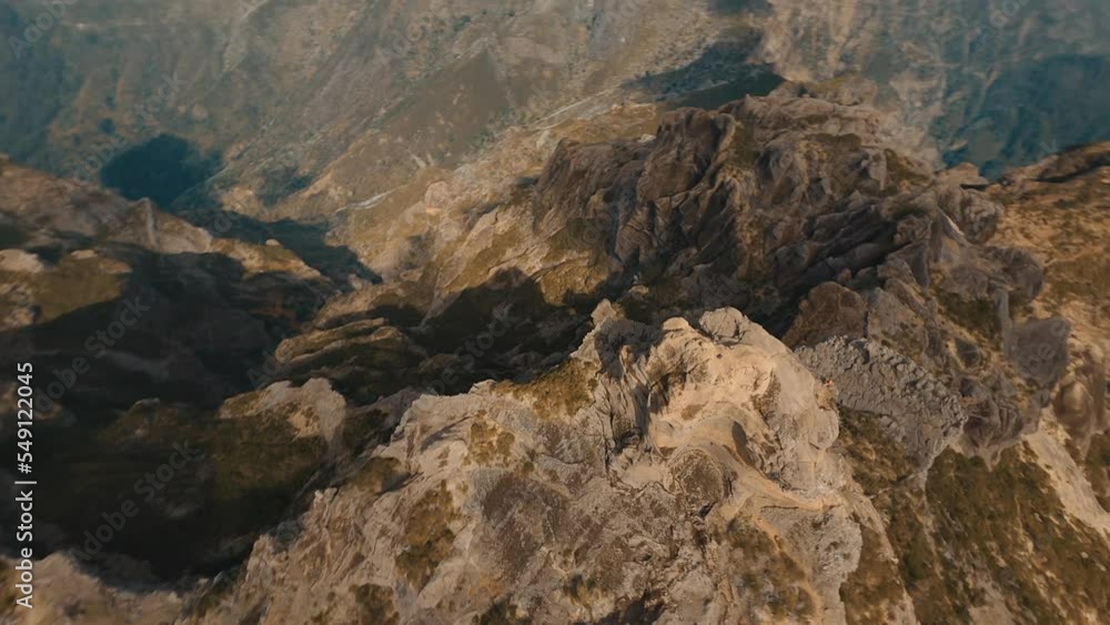 Drone flying over a cliff in the mountains on the island of Madeira in Portugal Drone flying over a cliff in the mountains on the island of Madeira in Portugal