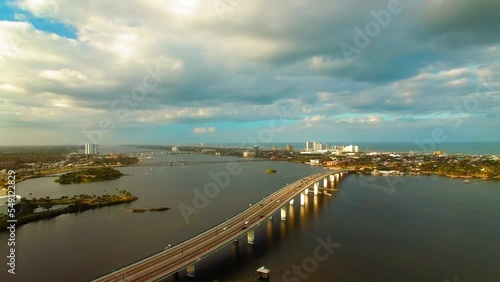 Wallpaper Mural Aerial Panning Shot Of Residential Buildings With Bridge Over Sea By News-Journal Center In City Under Cloudy Sky - Daytona Beach, Florida Torontodigital.ca