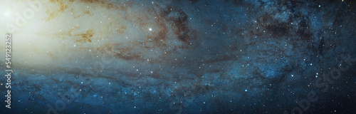 Panoramic view of the Andromeda galaxy constellation in outer space. Showing millions of stars and star clusters. Digitally enhanced. Elements of this image furnished by NASA.