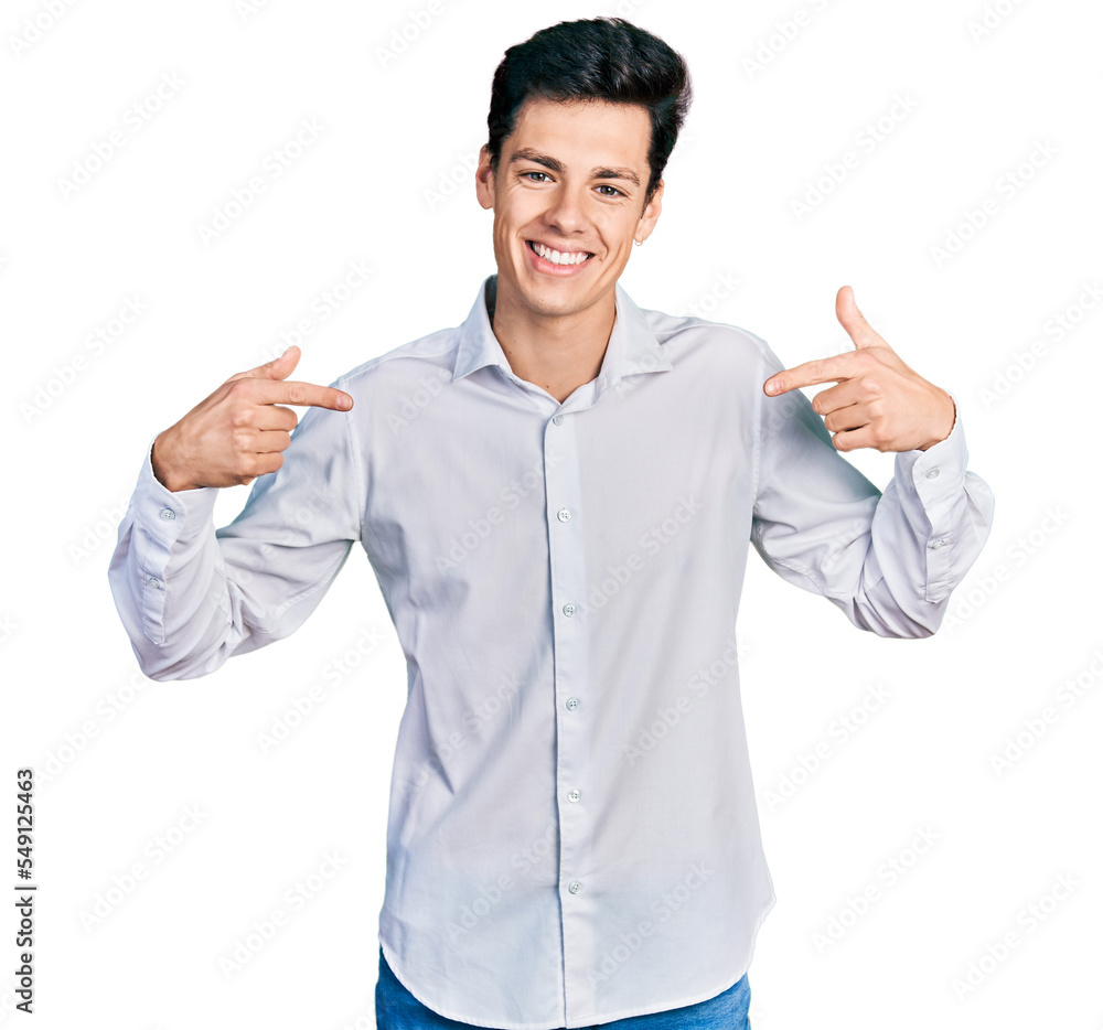 Young hispanic business man wearing business clothes looking confident with smile on face, pointing oneself with fingers proud and happy. Young hispanic business man wearing business clothes looking confident with smile on face, pointing oneself with fingers proud and happy.