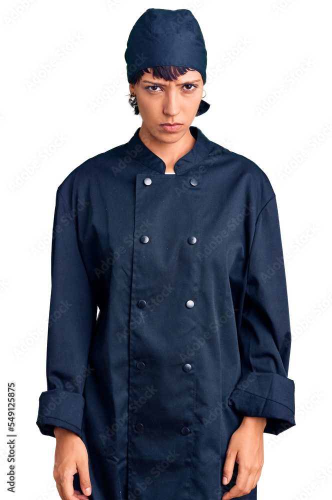 Young brunette woman with short hair wearing professional cook uniform skeptic and nervous, frowning upset because of problem. negative person. Young brunette woman with short hair wearing professional cook uniform skeptic and nervous, frowning upset because of problem. negative person.